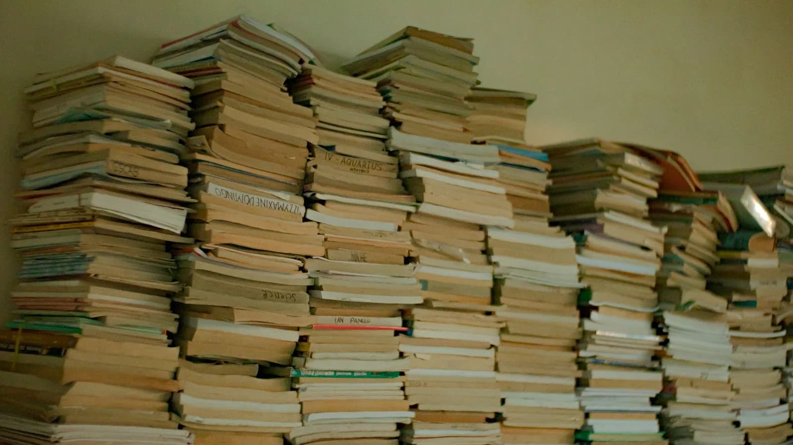 A stack of several different books, symbolizing the volume of extensive reading.