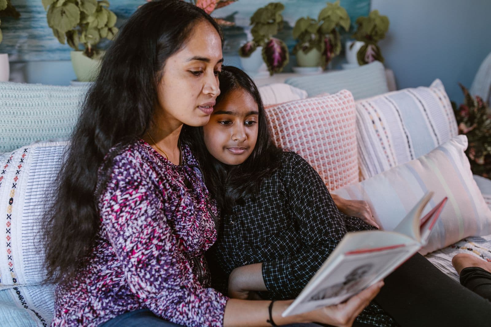Person reading calmly, focused on their book